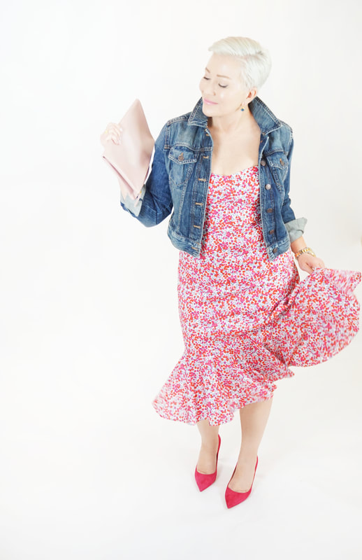 Mrs. Stafford in a flirty, floral dress, jean jacket, pink heels & clutch