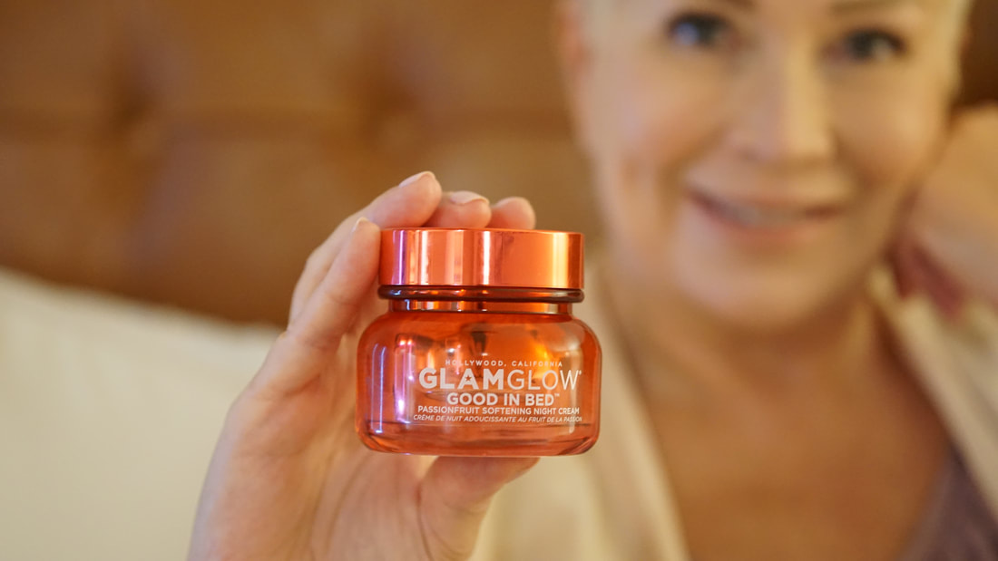 Mrs. Stafford holding the GlamGlow Good in Bed passion fruit night cream
