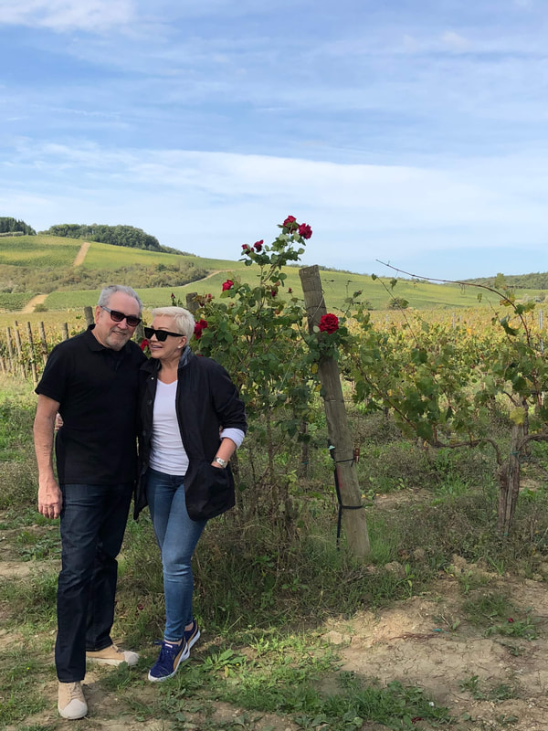 Mr. & Mrs. Stafford pose in a Vineyard in Tuscany