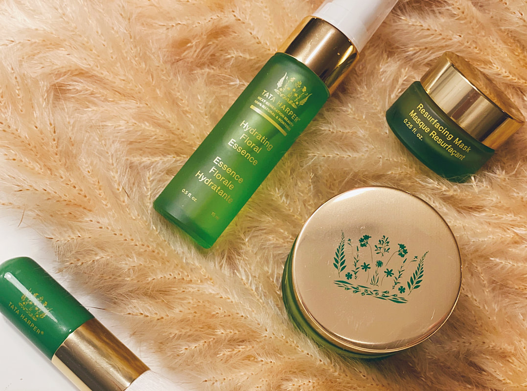 Green Tata Harper skin care products on blanket