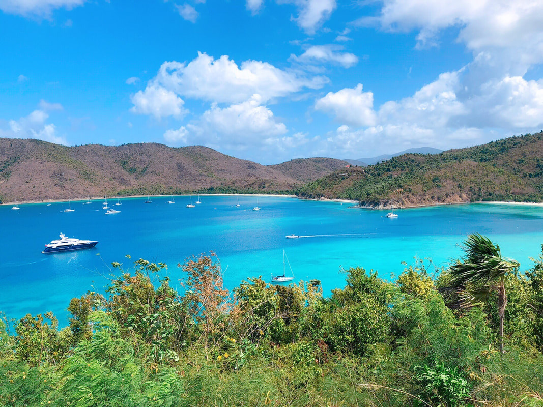 Blue water in St. John with a boat