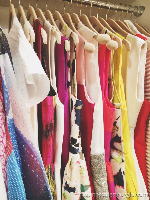 Color Coordinated Dresses Hanging in Closer